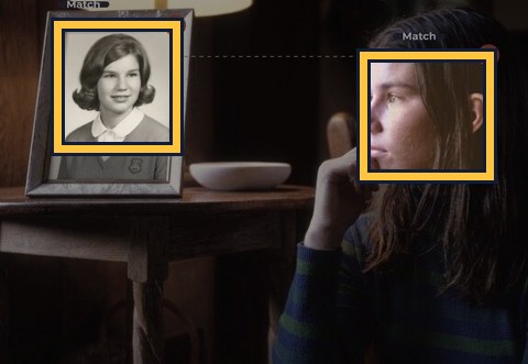 A framed photograph on a shelf, matched to the same person nearby.